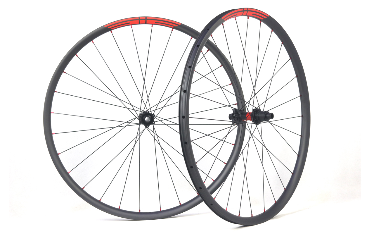 Carbon XC wheels with new DT Swiss 240 exp boost hubs red nipples and orange decals 