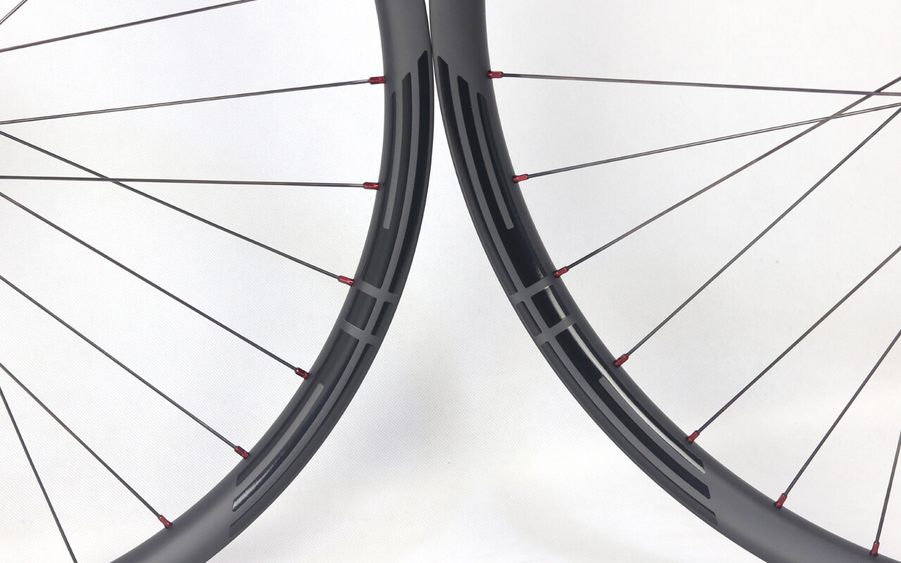 eie carbon bike rims and wheels with black glossy decals and red nipples built 